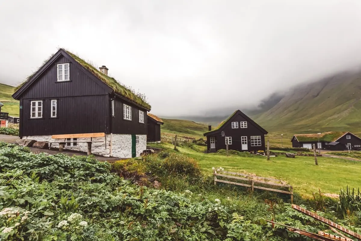 Traditional black turf-roof houses in Gásadalur village, Faroe Islands