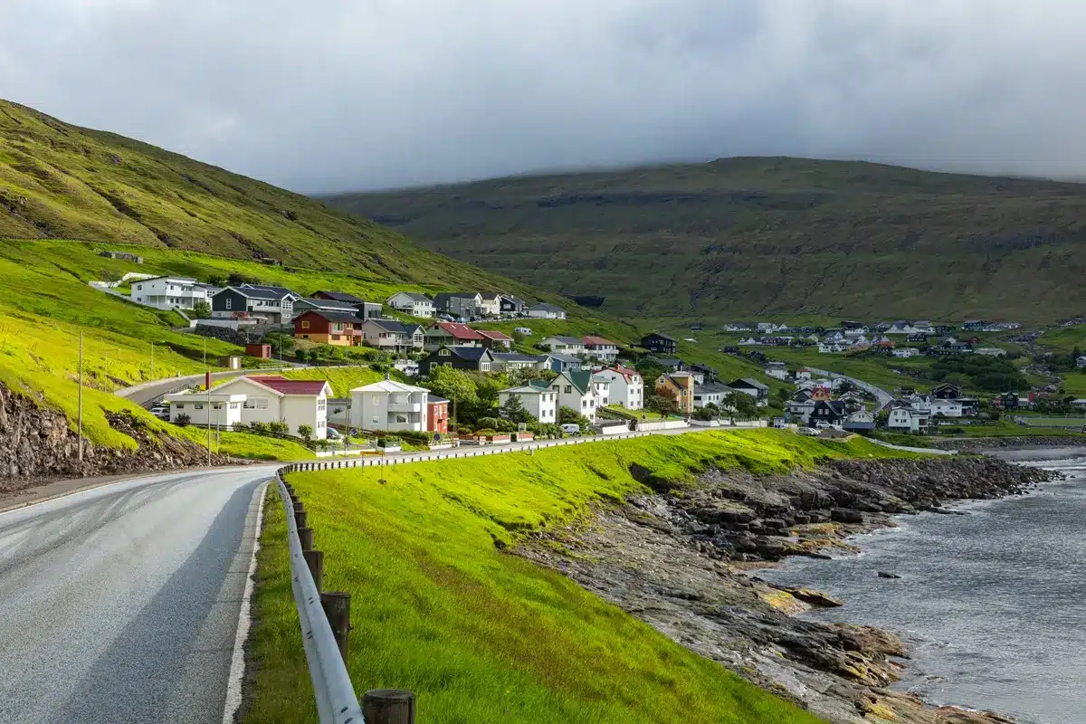 Scenic road from Miðvágur leading toward Sandavágur village.